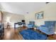 Inviting living room with hardwood floors, blue furniture, and natural light at 223 Royal Oaks Cir, Longwood, FL 32779