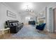 Bright living room with fireplace, skylight, and modern furniture at 223 Royal Oaks Cir, Longwood, FL 32779