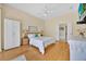 Calming bedroom with a queen-sized bed, wardrobe, and doorway leading to the bathroom at 233 Cadiz Loop, Davenport, FL 33837