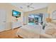 Relaxing bedroom showcasing a plush bed and sliding glass doors to the pool and backyard at 233 Cadiz Loop, Davenport, FL 33837
