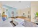 Spacious and modern living area with hardwood floors, a stylish rug, and a comfortable sofa at 233 Cadiz Loop, Davenport, FL 33837