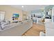 Spacious living room blending seamlessly into a modern kitchen and dining area at 233 Cadiz Loop, Davenport, FL 33837