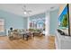 Bright living room with a sliding door to the lanai and a comfortable seating area at 233 Cadiz Loop, Davenport, FL 33837