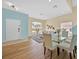 Inviting living room featuring an open floor plan, hardwood floors, and ample natural light at 233 Cadiz Loop, Davenport, FL 33837