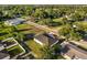 Home aerial highlighting backyard with mature trees and landscaping, close to neighborhood amenities at 2446 Greenway, Sanford, FL 32771