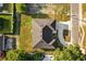 Bird's eye view of a home, showing the rooftop, long driveway, and the lush greenery, giving a clear perspective at 2446 Greenway, Sanford, FL 32771