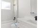 Modern bathroom with marble tile shower, double sink vanity, and matte black fixtures at 2446 Greenway, Sanford, FL 32771