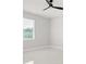 Bedroom featuring a large window, marble floors, and ceiling fan at 2446 Greenway, Sanford, FL 32771