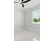 Bright bedroom featuring marble floors, large window, and a modern ceiling fan at 2446 Greenway, Sanford, FL 32771
