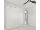 This bedroom boasts white marble floors, closet with sliding doors, and modern fan at 2446 Greenway, Sanford, FL 32771