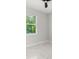 Clean bedroom with ample natural light from the window and marble floors at 2446 Greenway, Sanford, FL 32771