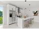 Modern kitchen featuring stainless steel appliances, island with counter seating and marble floors at 2446 Greenway, Sanford, FL 32771