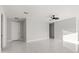 Spacious living room with white marble floors, modern ceiling fan, and bright natural light at 2446 Greenway, Sanford, FL 32771