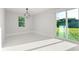 Bright living area with a sliding glass door offering tons of natural light and marble floors at 2446 Greenway, Sanford, FL 32771