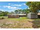 Exterior view of the home's backyard, offering a private space and green surroundings at 247 Carmen Ln, Debary, FL 32713