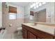 This bathroom has a cream countertop, wood cabinets, and decorative tile at 247 Carmen Ln, Debary, FL 32713