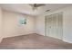 This cozy bedroom has neutral paint, a ceiling fan, and a closet at 247 Carmen Ln, Debary, FL 32713