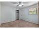 Bright bedroom featuring neutral paint and a fan, filled with natural light at 247 Carmen Ln, Debary, FL 32713