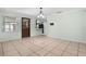 Bright dining area featuring tile flooring with outdoor access and modern chandelier fixture at 247 Carmen Ln, Debary, FL 32713