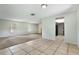 Bright living area with tile and carpet floors and natural light entering through the windows at 247 Carmen Ln, Debary, FL 32713
