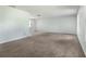 Bright living room with carpet and tile floors, fresh paint, and plenty of natural light at 247 Carmen Ln, Debary, FL 32713