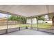 A screened patio offers an outdoor retreat with views of the backyard at 247 Carmen Ln, Debary, FL 32713