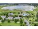 Stunning aerial view showcasing the community pool, clubhouse, and adjacent scenic lake at 2829 Red Alder Blvd, Ocoee, FL 34761