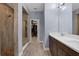 Contemporary bathroom with dual sink vanity, glass enclosed shower, and walk-in closet at 2829 Red Alder Blvd, Ocoee, FL 34761