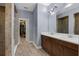 Contemporary bathroom with dual sink vanity, glass enclosed shower, and walk-in closet at 2829 Red Alder Blvd, Ocoee, FL 34761