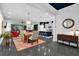 Expansive open living space with dining area, kitchen, comfortable seating, and modern decor at 2829 Red Alder Blvd, Ocoee, FL 34761