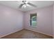 A cozy bedroom featuring fresh paint and window views, ensuring a serene and restful environment for relaxation at 2843 Grove Dr, Sanford, FL 32773
