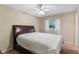 Comfortable bedroom featuring a bed, ceiling fan, and window providing natural light at 2843 Grove Dr, Sanford, FL 32773