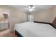 Bright bedroom featuring a ceiling fan and an adjoining bathroom entrance, providing a comfortable and private space at 2843 Grove Dr, Sanford, FL 32773