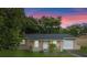 Charming single-story home with stucco exterior, arched entry, and attached one-car garage at 2843 Grove Dr, Sanford, FL 32773