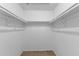 A functional, empty walk-in closet providing a blank canvas for organizing clothes and accessories with ample storage at 2843 Grove Dr, Sanford, FL 32773