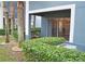 Comfortable covered back patio area with trimmed hedges and trees at 3321 Wilshire Way Rd # 6, Orlando, FL 32829