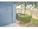 Cozy backyard featuring manicured shrubs, trees, and an AC unit at 3321 Wilshire Way Rd # 6, Orlando, FL 32829