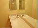 Bathroom featuring a double sink vanity with a large mirror at 3321 Wilshire Way Rd # 6, Orlando, FL 32829