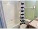 Clean bathroom showcasing a shower-tub combo and coordinated decor at 3321 Wilshire Way Rd # 6, Orlando, FL 32829