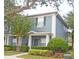 Charming two-story townhouse with a well-manicured lawn and lush landscaping at 3321 Wilshire Way Rd # 6, Orlando, FL 32829
