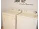 Convenient laundry room with a side-by-side washer and dryer set. 