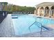Resort-style community swimming pool with ample seating and a spacious deck at 3321 Wilshire Way Rd # 6, Orlando, FL 32829