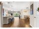 Open-concept kitchen with a large island, bar seating, and seamless flow into the dining and living areas at 337 Meadow Pointe Dr, Haines City, FL 33844