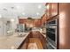 Modern kitchen features stainless steel appliances, a granite island, and ample cabinet space for storage and functionality at 337 Meadow Pointe Dr, Haines City, FL 33844