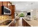 Well-equipped kitchen featuring granite countertops, a stylish backsplash, and stainless steel appliances for cooking at 337 Meadow Pointe Dr, Haines City, FL 33844
