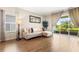 Inviting living room with sliding glass doors that showcase the outdoor landscape and enhance natural light at 337 Meadow Pointe Dr, Haines City, FL 33844