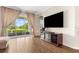 Comfortable living area with large screen tv and sliding glass door access to the outdoor area at 337 Meadow Pointe Dr, Haines City, FL 33844