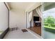 Patio with an outdoor seating area, offering a seamless indoor-outdoor transition and a view to the living room at 337 Meadow Pointe Dr, Haines City, FL 33844