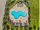 Overhead shot showcases a vibrant community pool with plenty of seating and a charming covered area at 337 Meadow Pointe Dr, Haines City, FL 33844