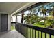 View of the yard and community from the balcony with black metal railings at 4403 S Semoran Blvd # 3, Orlando, FL 32822